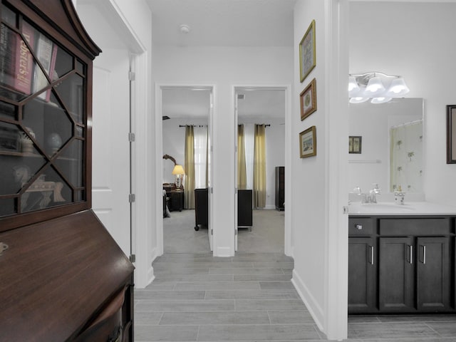 hallway featuring sink