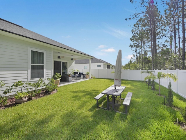 view of yard featuring ceiling fan and a patio area