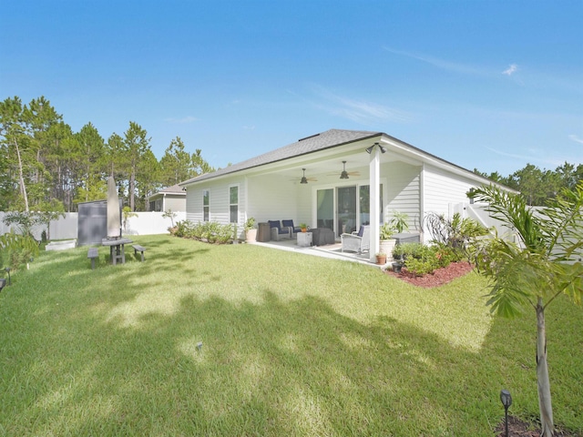 rear view of house with a yard, an outdoor hangout area, ceiling fan, and a patio area