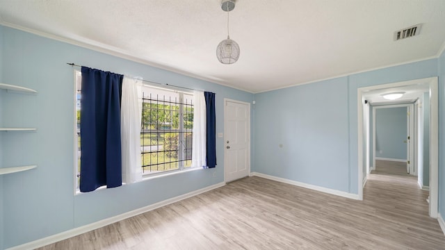 5015 Portsmouth Ave, Jacksonville, FL 32208 - unfurnished room featuring visible vents, baseboards, ornamental molding, and wood finished floors