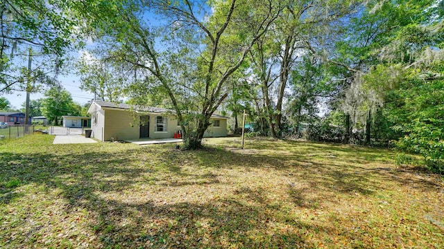 5015 Portsmouth Ave, Jacksonville, FL 32208 - view of yard featuring a patio and fence