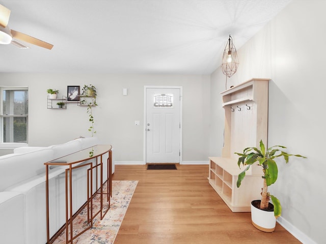 foyer entrance featuring ceiling fan and hardwood / wood-style floors