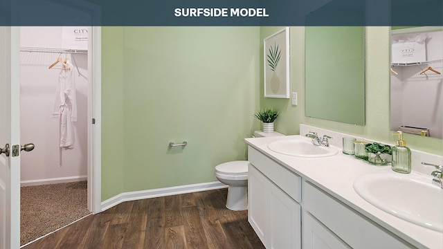 bathroom featuring hardwood / wood-style flooring, vanity, and toilet