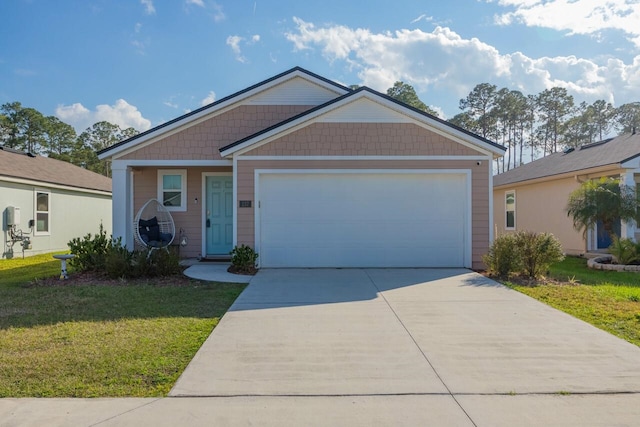 view of front of home featuring a garage and a front yard