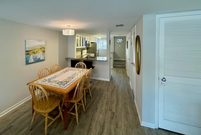 390 A1A Beach Blvd Unit 49, Saint Augustine Beach, FL 32080 - dining space featuring dark wood finished floors and baseboards