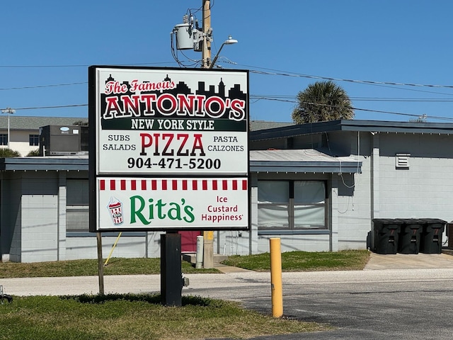 390 A1A Beach Blvd Unit 49, Saint Augustine Beach, FL 32080 - exterior view of concrete block siding and a chandelier