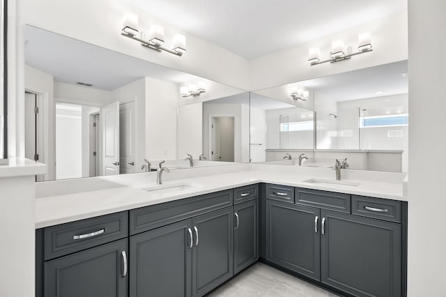 bathroom featuring tile patterned flooring and vanity