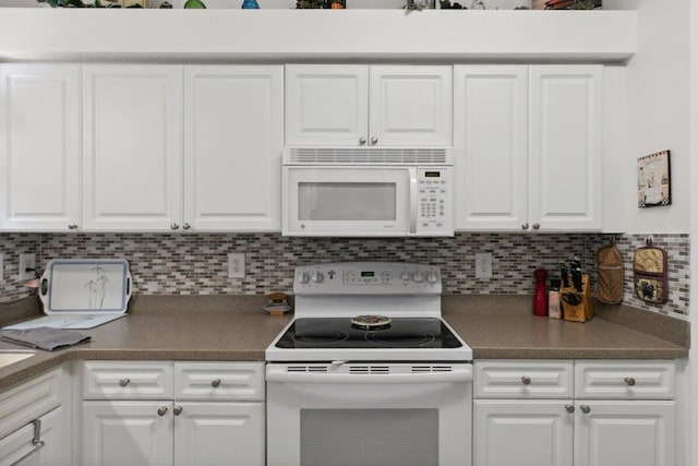 104 Laurel Wood Way Unit 202, Saint Augustine, FL 32086 - kitchen featuring white appliances and white cabinetry