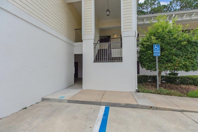 104 Laurel Wood Way Unit 202, Saint Augustine, FL 32086 - doorway to property with stucco siding