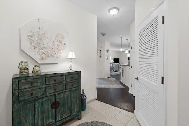 104 Laurel Wood Way Unit 202, Saint Augustine, FL 32086 - corridor with light tile patterned flooring and baseboards