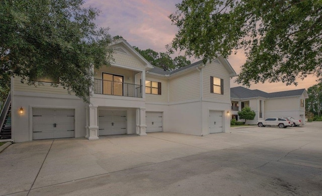 104 Laurel Wood Way Unit 202, Saint Augustine, FL 32086 - view of front of property with an attached garage, stucco siding, and a balcony