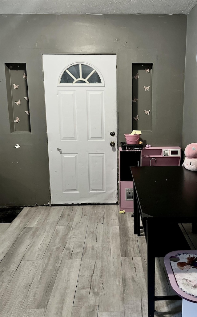 foyer featuring light wood-type flooring