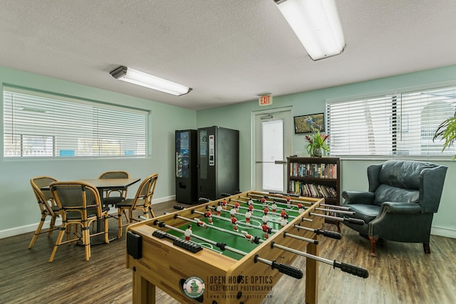 4670 A1A S Unit 1309, Saint Augustine, FL 32080 - rec room with baseboards, a textured ceiling, and wood finished floors