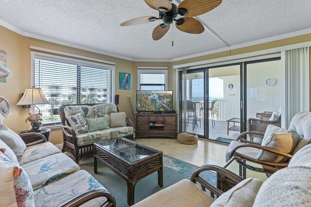 4670 A1A S Unit 1309, Saint Augustine, FL 32080 - living area with a textured ceiling, tile patterned floors, ornamental molding, and a ceiling fan
