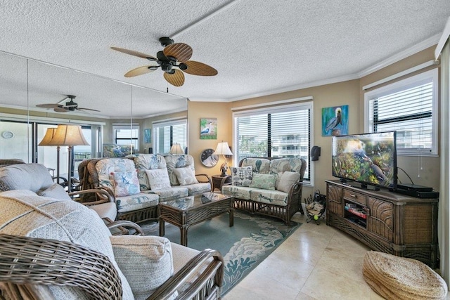 4670 A1A S Unit 1309, Saint Augustine, FL 32080 - living room featuring a textured ceiling, a ceiling fan, tile patterned floors, and crown molding