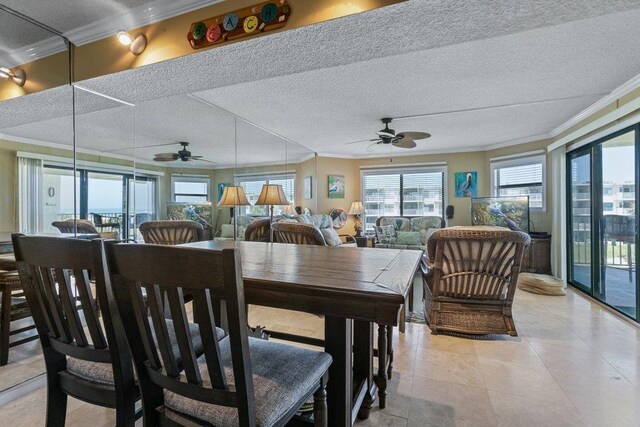4670 A1A S Unit 1309, Saint Augustine, FL 32080 - dining area featuring a textured ceiling, light tile patterned floors, ornamental molding, and a ceiling fan