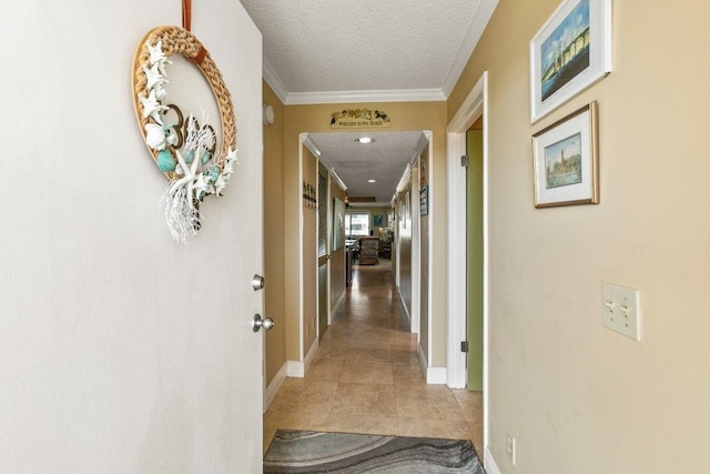 4670 A1A S Unit 1309, Saint Augustine, FL 32080 - corridor featuring baseboards, light tile patterned floors, a textured ceiling, and crown molding