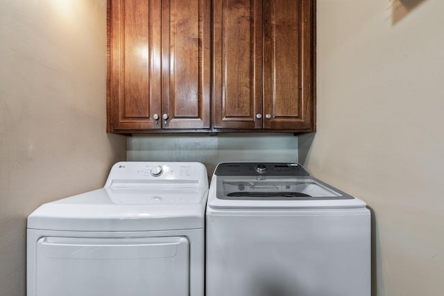 4670 A1A S Unit 1309, Saint Augustine, FL 32080 - clothes washing area with cabinet space and washing machine and dryer