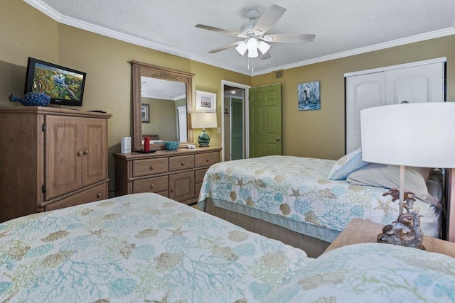 4670 A1A S Unit 1309, Saint Augustine, FL 32080 - bedroom with a textured ceiling, ornamental molding, visible vents, and a ceiling fan