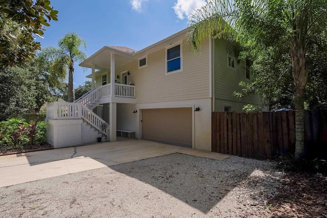 view of front of home featuring a porch and a garage