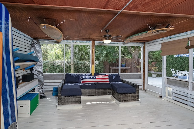 sunroom with wooden ceiling, ceiling fan, and a healthy amount of sunlight