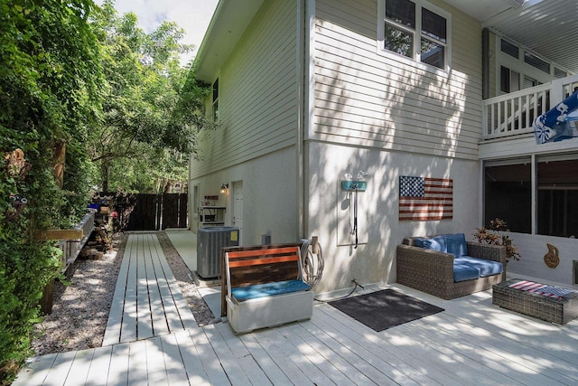 wooden terrace featuring central air condition unit