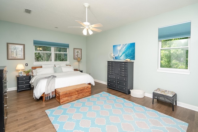 bedroom featuring dark hardwood / wood-style flooring and ceiling fan