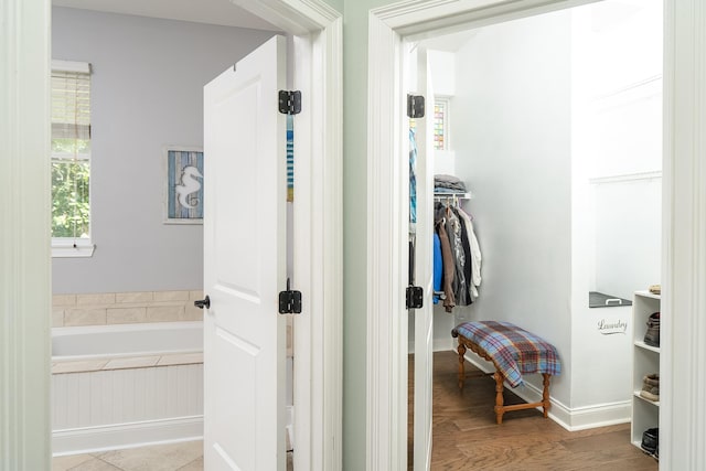 corridor featuring light hardwood / wood-style floors