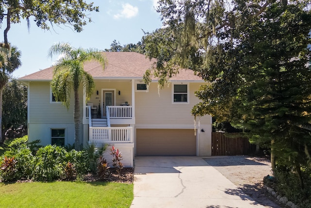 view of front of home featuring a porch and a garage