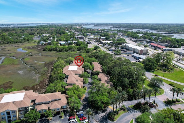 drone / aerial view featuring a water view and a residential view