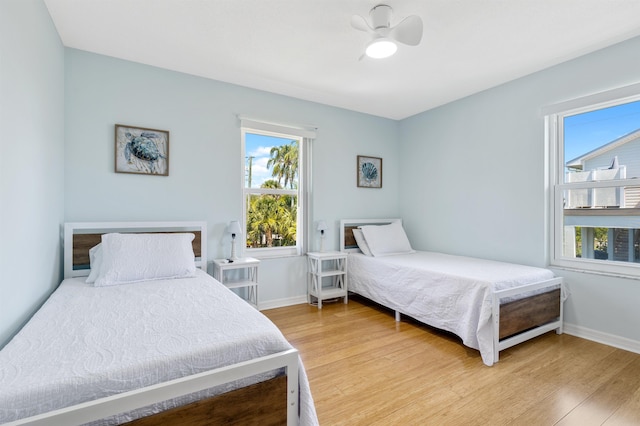 bedroom featuring hardwood / wood-style flooring and ceiling fan