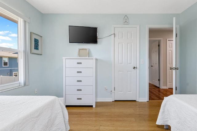 bedroom with light hardwood / wood-style floors