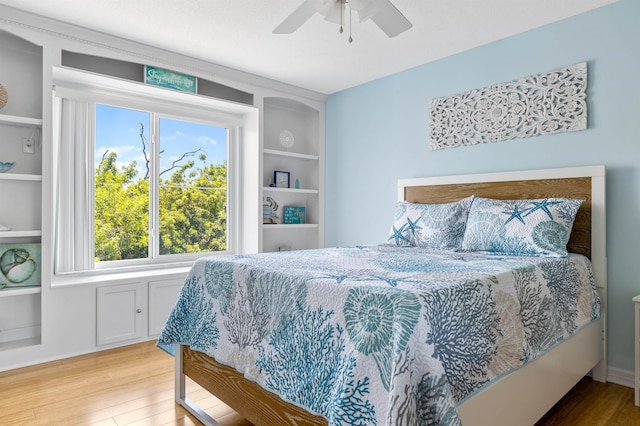 bedroom featuring ceiling fan and light hardwood / wood-style floors