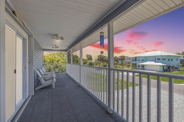 balcony at dusk with ceiling fan