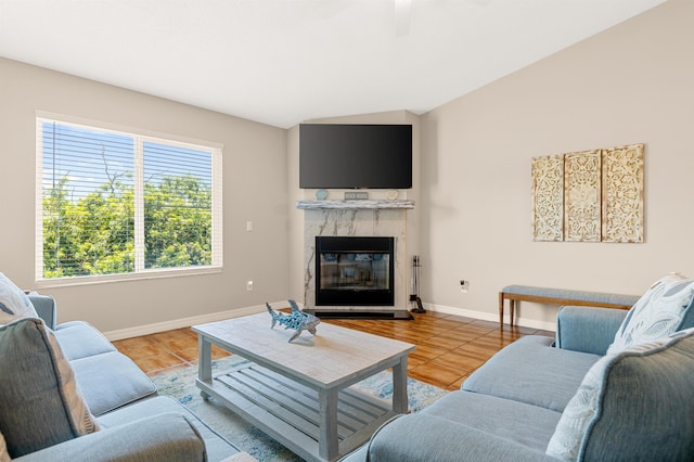 living room with a fireplace and light hardwood / wood-style floors