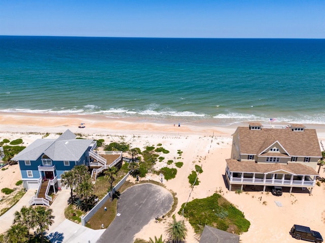 bird's eye view with a view of the beach and a water view