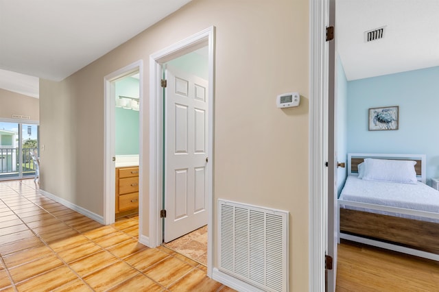 hallway with light tile patterned floors