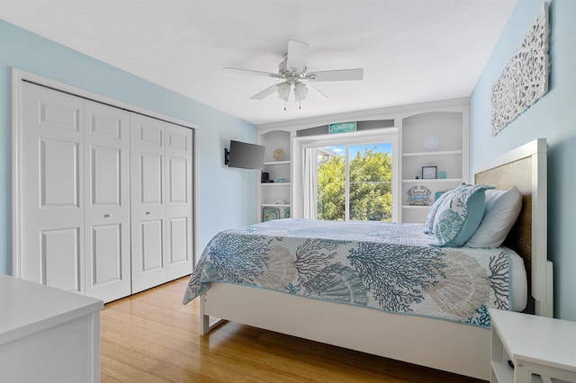 bedroom featuring ceiling fan, wood-type flooring, and a closet