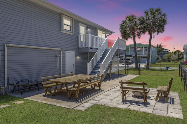 patio terrace at dusk with a lawn