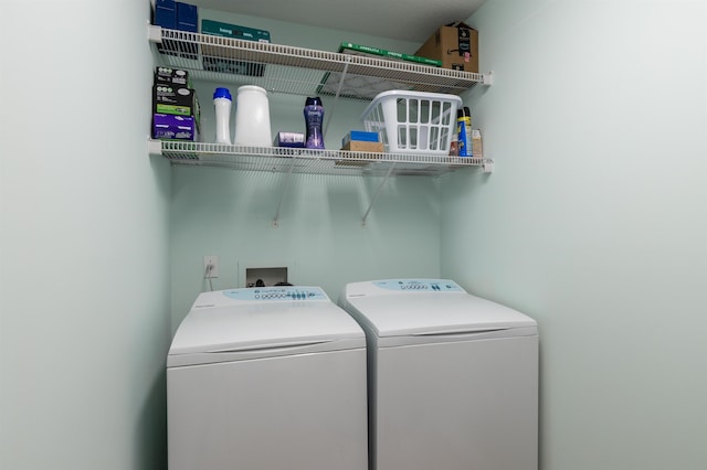 laundry room with independent washer and dryer