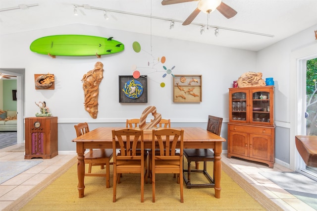 dining room featuring light tile patterned floors and a ceiling fan