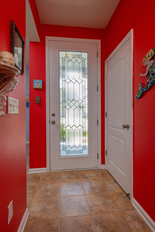 116 Serenity Bay Blvd, Saint Augustine, FL 32080 - foyer entrance with baseboards and stone finish flooring