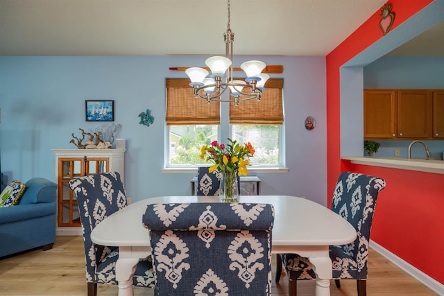 116 Serenity Bay Blvd, Saint Augustine, FL 32080 - dining room with a chandelier and light wood-style floors