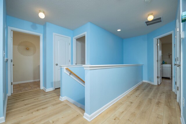 116 Serenity Bay Blvd, Saint Augustine, FL 32080 - hall featuring an upstairs landing, light wood-style flooring, and recessed lighting