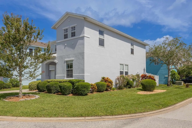 116 Serenity Bay Blvd, Saint Augustine, FL 32080 - view of home's exterior featuring a lawn and stucco siding
