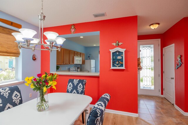 116 Serenity Bay Blvd, Saint Augustine, FL 32080 - dining room featuring a chandelier and baseboards