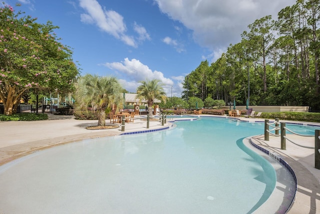 community pool featuring a patio area