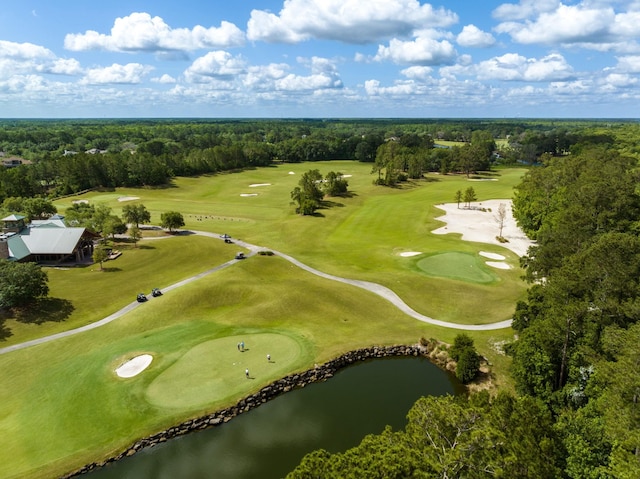 aerial view with view of golf course, a water view, and a wooded view