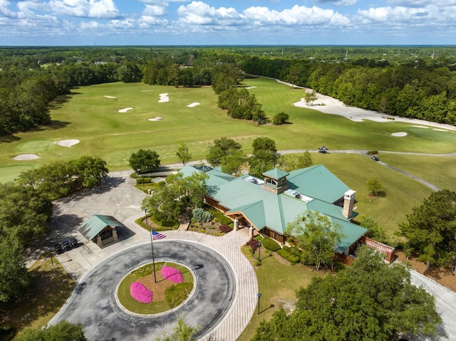 bird's eye view with a wooded view