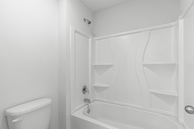 bathroom with toilet and tub / shower combination